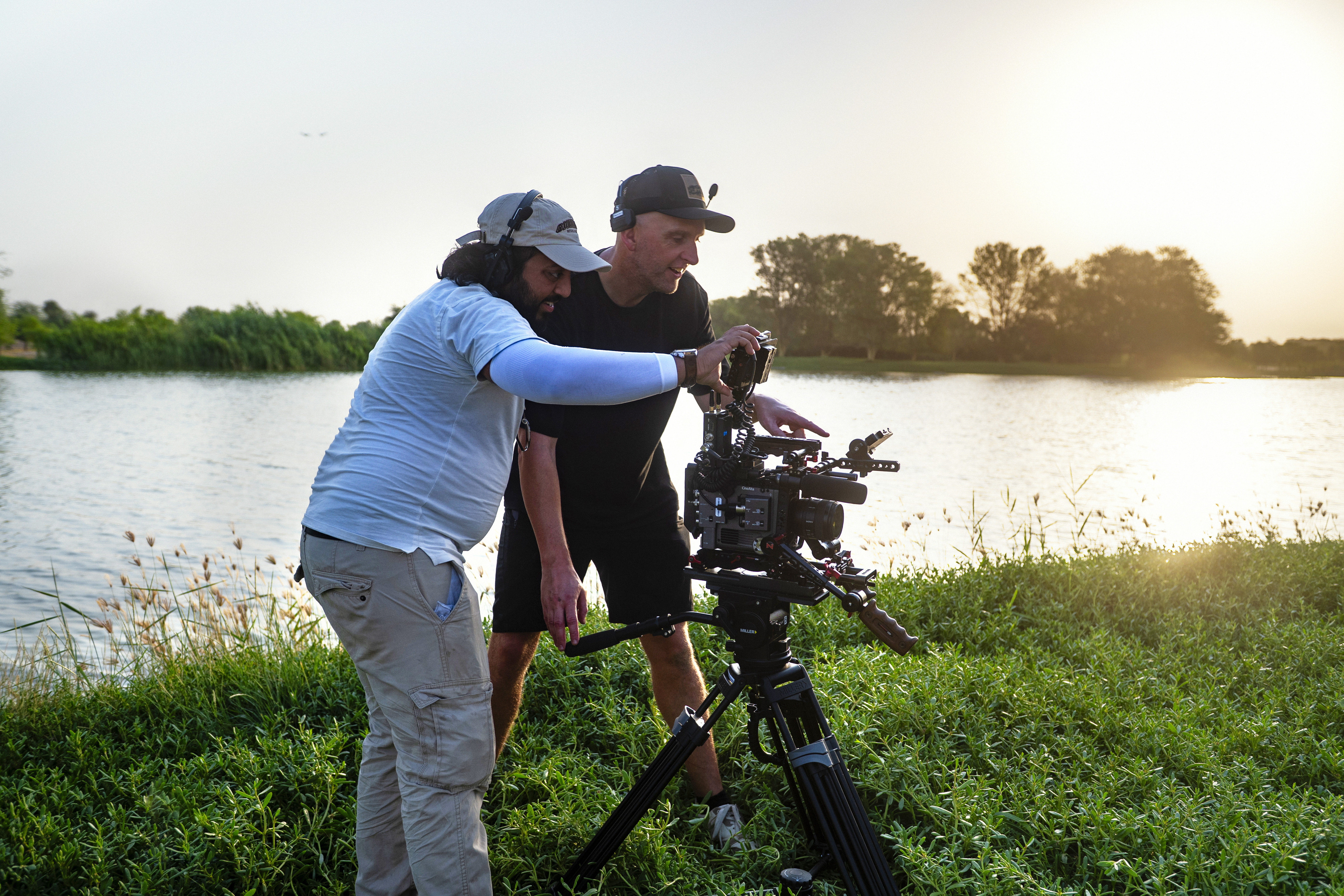 Green Frame crew on location, filming at sunset